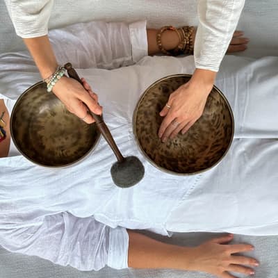 Tibetan bowls massage session delivering vibrational therapy for deep rest