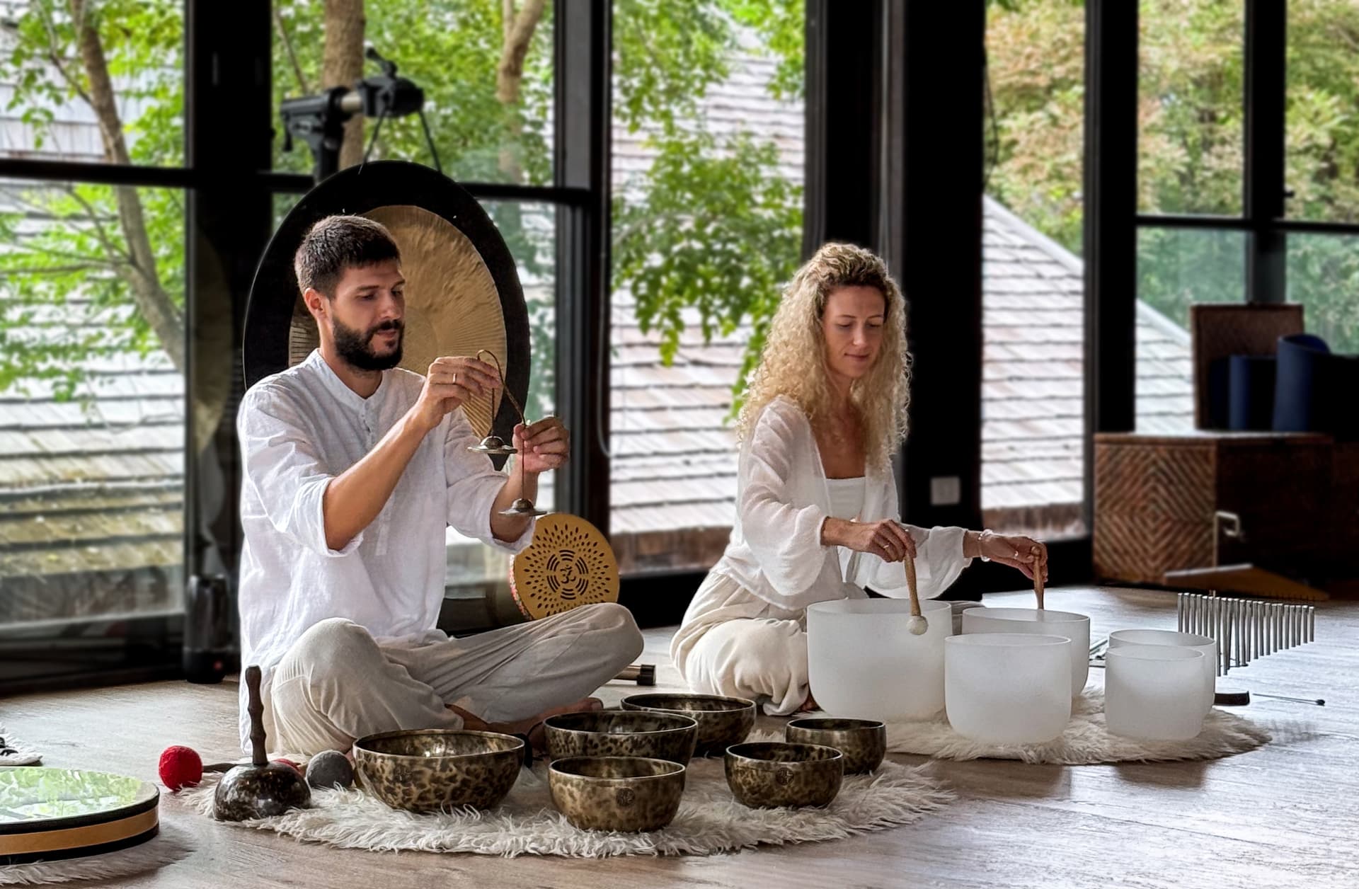 Sontera gift voucher set beside crystal bowls and gongs in a softly lit studio.